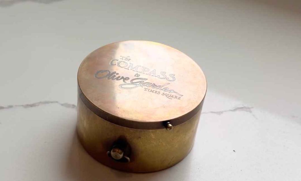 A compass that only points to the Times Square Olive Garden
