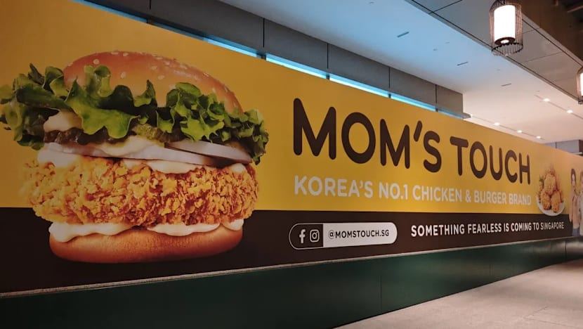 Korean fast food chain Mom's Touch returning to Singapore, banner with K-pop group Le Sserafim seen at Chinatown