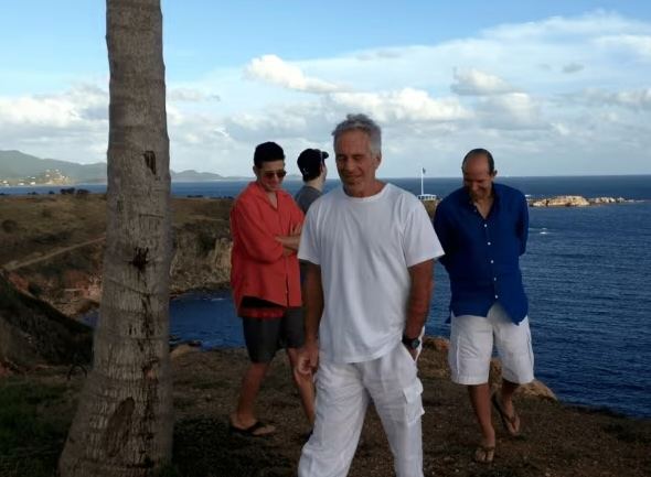 Trump insists Lutnick "very innocent" after photo emerges of him on Epstein' island