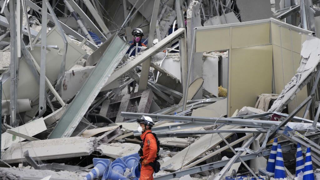 Japan searches for earthquake survivors as thousands evacuate
