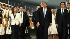 Trade, Iran and Taiwan on the agenda as Trump arrives in China for high-stakes talks with Xi 