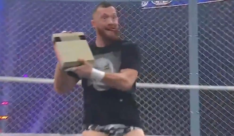 Large Man Blows In Cartridge, Sticks It In An NES, And Smashes Another Man’s Face With It