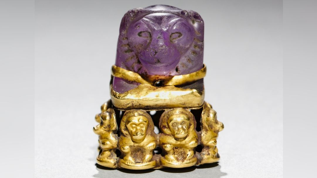  Lion's head pendant: An ancient Egyptian board game piece that was later repurposed into a magical religious object with baboons 