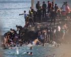 At least 57 people die as tens of thousands cross to Spanish enclave of Ceuta from Morocco